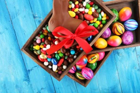 Chocolate Easter eggs and chocolate bunny and colorful sweets Stock Photos
