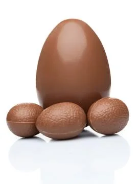 Chocolate Easter eggs and sweets on white background Stock Photos