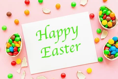 Chocolate Easter eggs, blank of paper with transcription Happy Easter and col Stock Photos