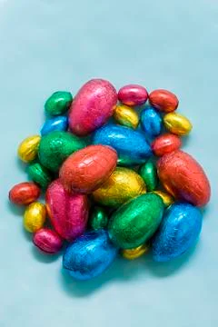 Chocolate Easter eggs in coloured foil Stock Photos