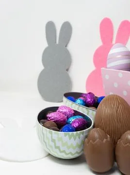 Chocolate Easter eggs in egg-shaped containers Stock Photos