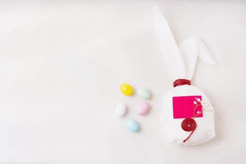 Chocolate Easter eggs glazed with pastel coloring over white background. Bunn Stock Photos