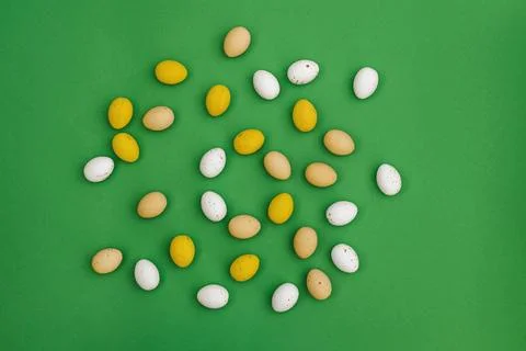 Chocolate Easter eggs on green background Stock Photos