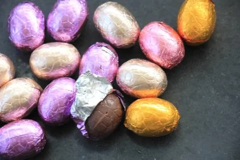 Chocolate easter eggs in metallic foil, various colors Stock Photos