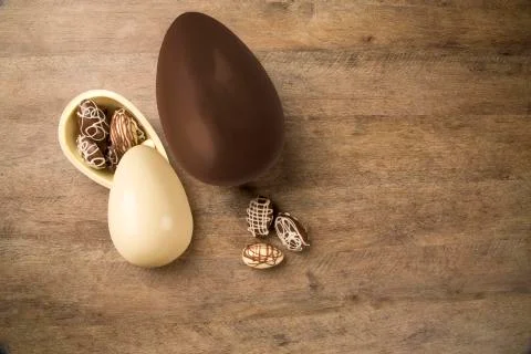 Chocolate Easter Eggs Over Wooden Background. Stock Photos