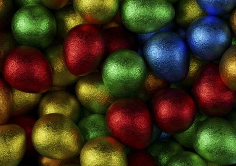 Chocolate easter eggs with red, orange, blue, green and yellow foil. Stock Photos