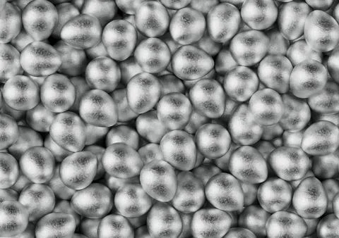Chocolate easter eggs with silver Aluminium foil. Wallpaper. backdrop. Stock Photos