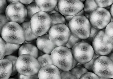 Chocolate easter eggs with silver Aluminium foil. Wallpaper. backdrop. Stock Photos