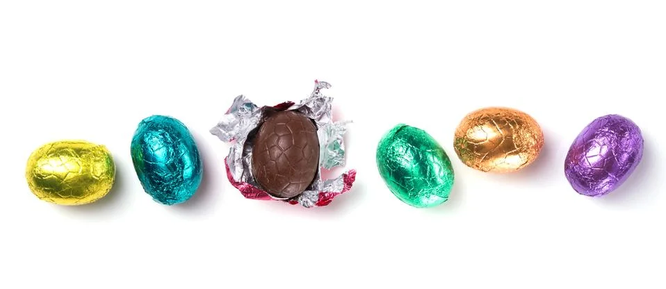 Chocolate easter eggs wrapped in multi colored foil isolated on white Stock Photos