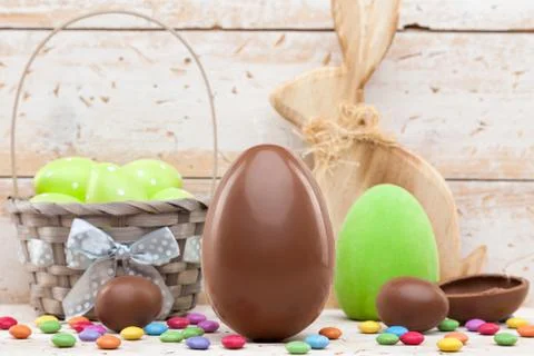 Chocolate Easter holiday egg on rustic backround Stock Photos