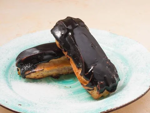 Chocolate Eclair cake on a plate. Close up Stock Photos
