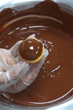 Chocolate eclair preparation, also known as chocolate profiteroles Stock Photos