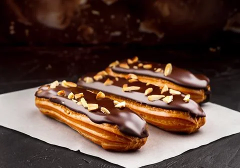 Chocolate eclairs with calamelized nuts 写真素材