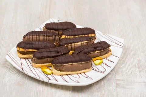 Chocolate eclairs on plate Stock-Fotos