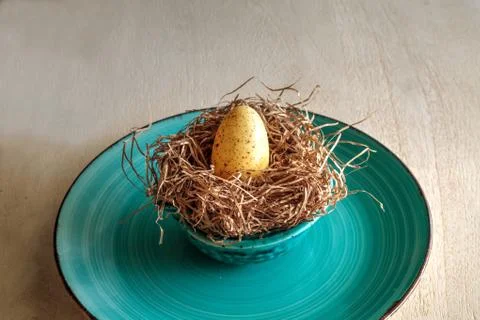 Chocolate egg in an Easter basket nest Stock Photos