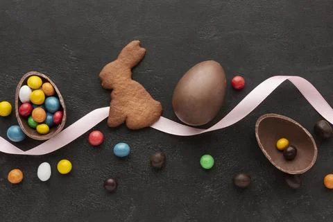 Chocolate egg easter bunny shaped cookie with candy Stock Photos