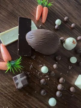 Chocolate egg with mixed chocolates Stock Photos