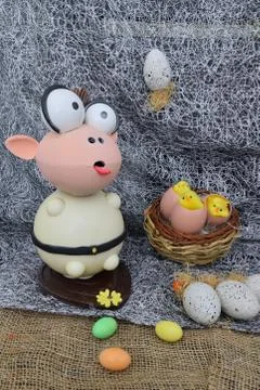 Chocolate egg in the shape of a lamb with various decorations Stockfoto's