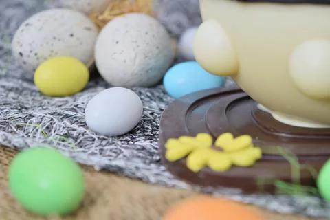 Chocolate egg in the shape of a lamb with various decorations 库存照片