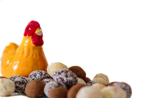 Chocolate eggs with a chicken on the background Stock Photos