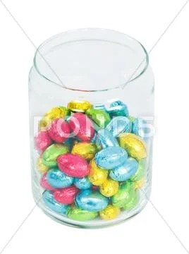 Chocolate eggs in a jar. Traditional Easter sweet. Stock Photos