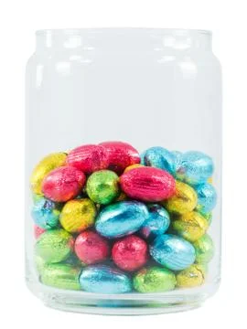 Chocolate eggs in a jar. Traditional Easter sweet. Stock Photos