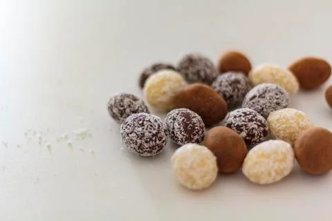 Chocolate eggs on white table Stock Photos