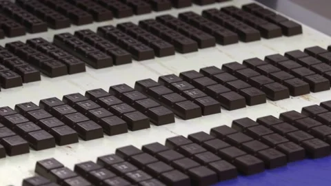 Chocolate factory. Conveyor belt with chocolate on it. Stock Footage