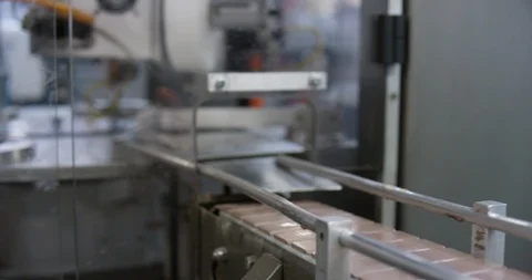 Chocolate factory machine pushing wrapped chocolates Stock Footage 104001275