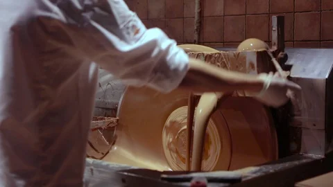 Chocolate factory, the process of making chocolate. pouring liquid chocolate Stock Footage 107137315