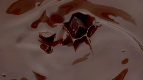 Chocolate Falling in the Melted Chocolate  Super Slow Motion  1000fps. Stock Footage 281715965