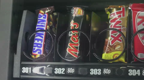 Chocolate  falls from vending machine Video stock 25016606