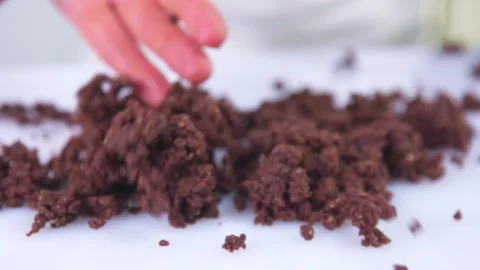 Chocolate falls on a white background in slow motion. Stock Footage 141969842