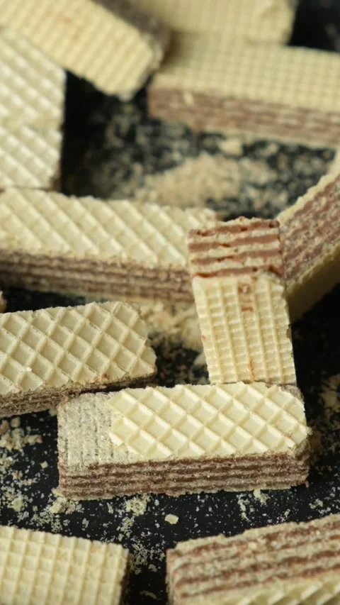 Chocolate filled wafer blocks falling on stack slow motion Stock Footage 347276546