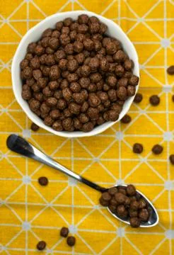 Chocolate flake balls, in a deep dish on a yellow bright tablecloth Foto stock