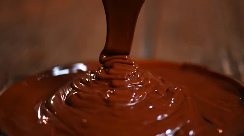 Chocolate flow. Close up of liquid hot chocolate. Stock Footage 50048829