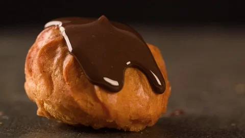 Chocolate is flowing on sweet cake close up cooking food video Stock Footage 102620623