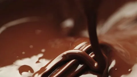 Chocolate flows into chocolate Stock Footage 161077179