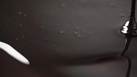 Chocolate flows in a thin stream. Stock Footage 168409898