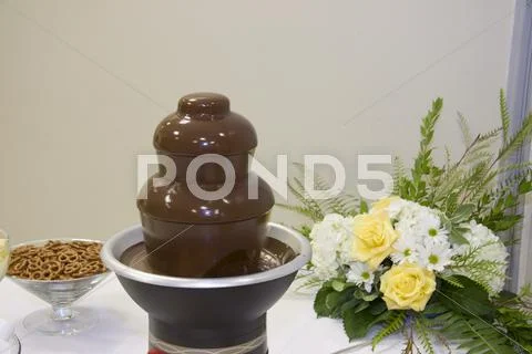 Chocolate fondue fountain Stock Photos