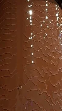 Chocolate fountain flows effortlessly, emphasizing sustainable choices in Stock Photos
