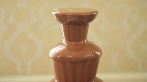 Chocolate fountain placed on a table Stock Footage 62485991