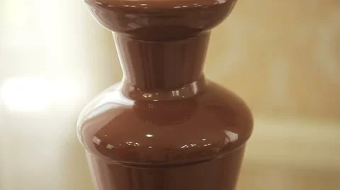 Chocolate fountain placed on a table Stock Footage 62486153