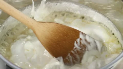 Chocolate fudge being made: marshmallows, sugar, condensed milk and butter being Stock Footage 24672706