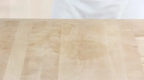Chocolate fudge being removed from the baking tin and the aluminium foil being Stock Footage 24672723
