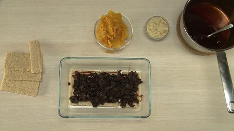 Chocolate glaze put on a cake. Stock Footage 78498620