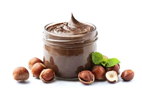 Chocolate with hazelnuts splash with filbert nuts Stock Photos