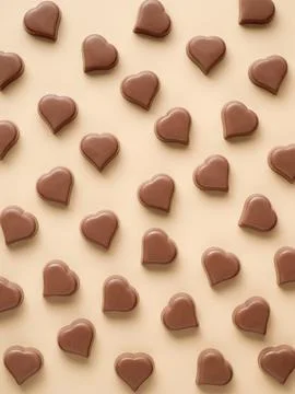 Chocolate hearts candies pattern, vertical flatlay Stock Photos