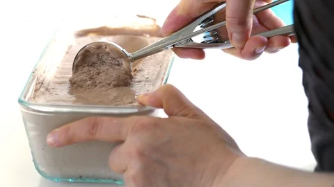 Chocolate ice cream is collected with a spoon. Stock Footage 88964765