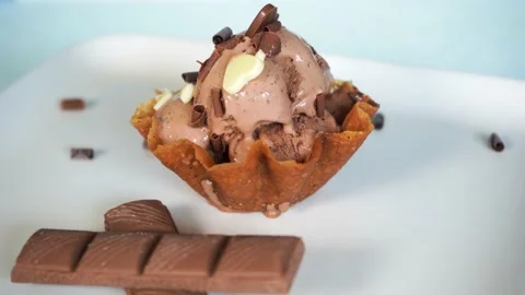 Chocolate ice cream in snap basket waffle with bars and decoration, 4K close up Stock Footage 156707967